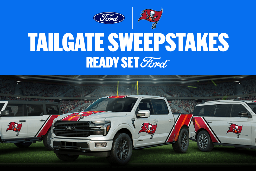 Ford Tailgate Sweepstakes prize image showing a Tampa Bay Buccaneers-wrapped Ford pickup truck on a football field with stadium lights in the background. Buccaneers Ford tailgate giveaway artwork featuring a branded Ford truck and tailgate-style scene promoting a chance to win a Ford vehicle and NFL fan prizes.