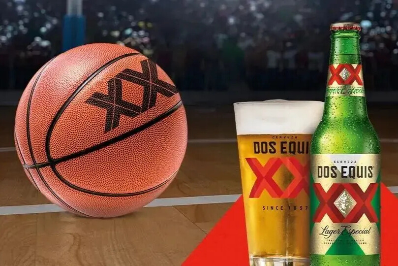 A basketball on a hardwood court beside a Dos Equis beer bottle and branded pint glass, representing the Dos Equis College Basketball Pop-A-Shot Sweepstakes prize imagery, sports-themed giveaway, and basketball championship promotion.