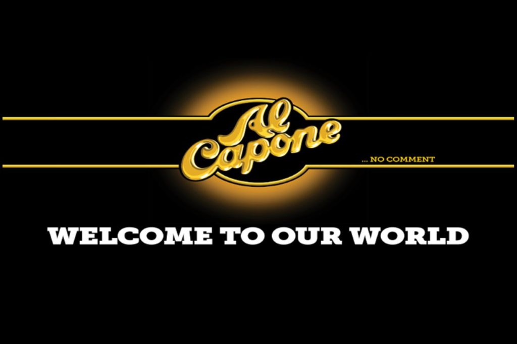 A black-and-gold Al Capone “Welcome to Our World” graphic used for the Al Capone Fresh Start Cash Giveaway, promoting a $500 cash prize awarded as a check. The image supports a $500 cash sweepstakes with weekly random drawings and multiple winners, highlighting a simple daily-entry cash giveaway for eligible U.S. participants.