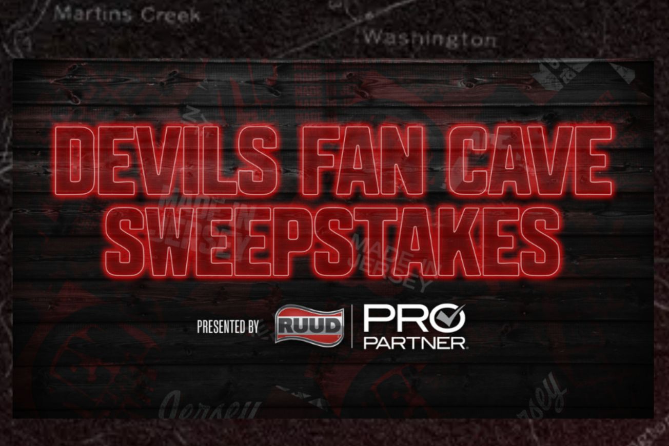 A dark, wood-textured graphic reads “Devils Fan Cave Sweepstakes” in bright red neon-style letters, with “presented by RUUD Pro Partner” below, promoting a New Jersey Devils fan cave sweepstakes for a custom Devils fan cave prize package.