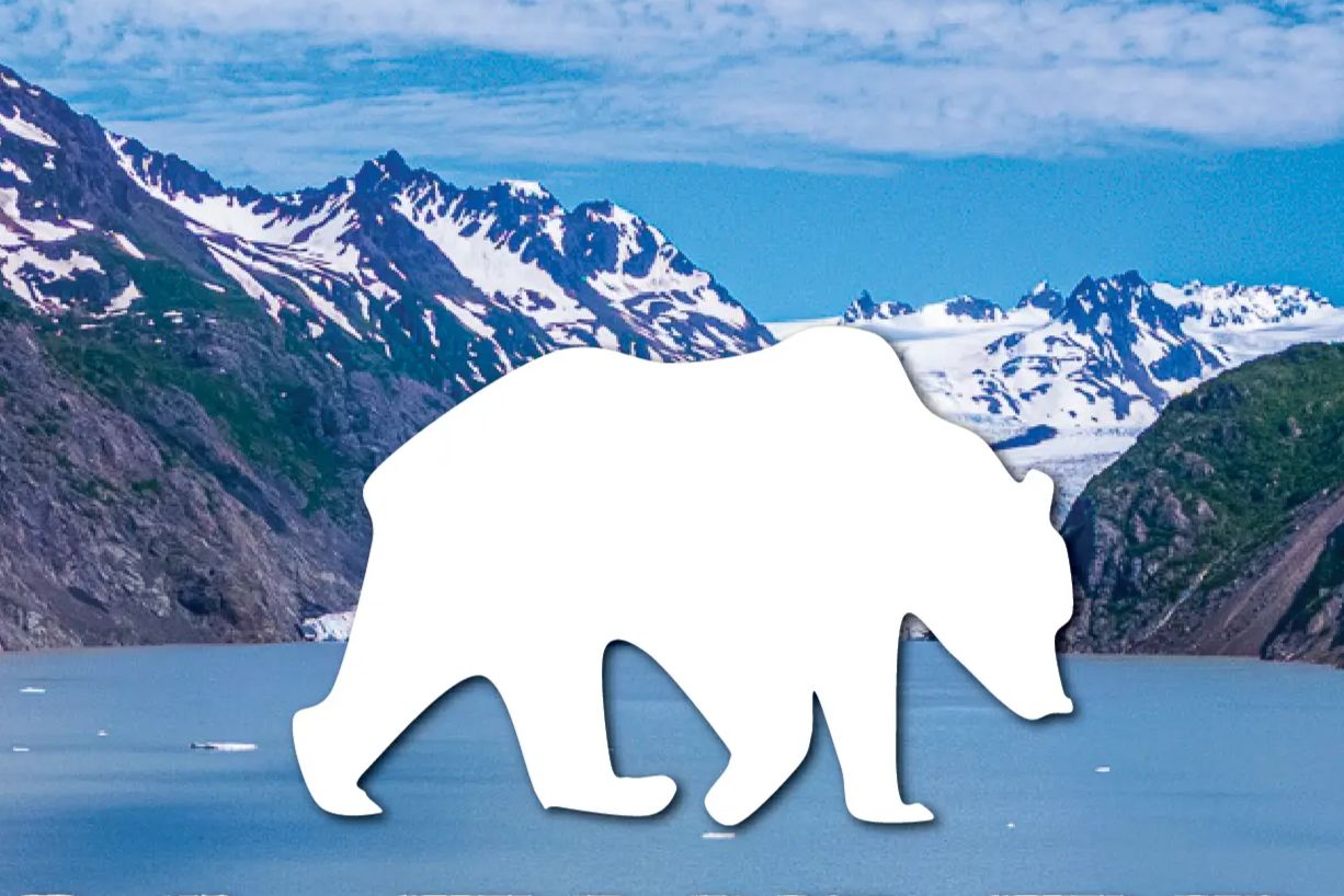 Snowcapped Alaska mountains and a glacier-filled bay with a large white bear silhouette in the center, representing the Alaska Experience Giveaway grand prize trip. Scenic Alaska travel giveaway image showing rugged peaks, icy water, and a bear icon tied to a dream vacation to Alaska sweepstakes. Duluth Pack Alaska Experience Giveaway graphic featuring an outdoor adventure backdrop, Alaska retreat trip prize, and wilderness-themed sweepstakes imagery.