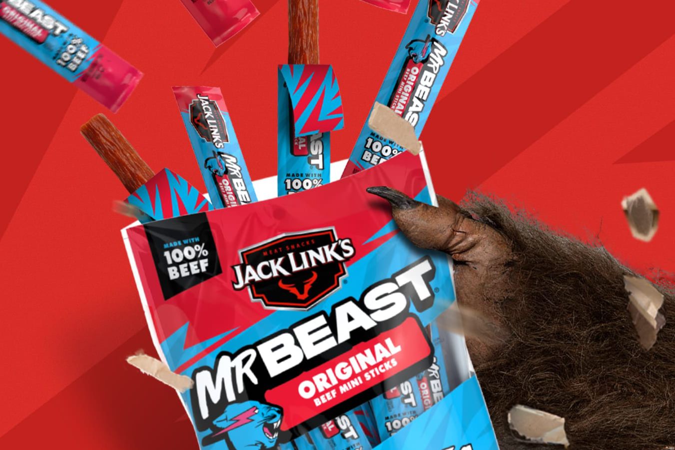 A bold red Jack Link’s x MrBeast Snack Like A Beast Sweepstakes image showing a MrBeast Original mini beef sticks bag with beef sticks popping out and a beast-like hand gripping the package, promoting the Jack Link’s MrBeast sweepstakes to win $100,000 cash and other cash prizes.