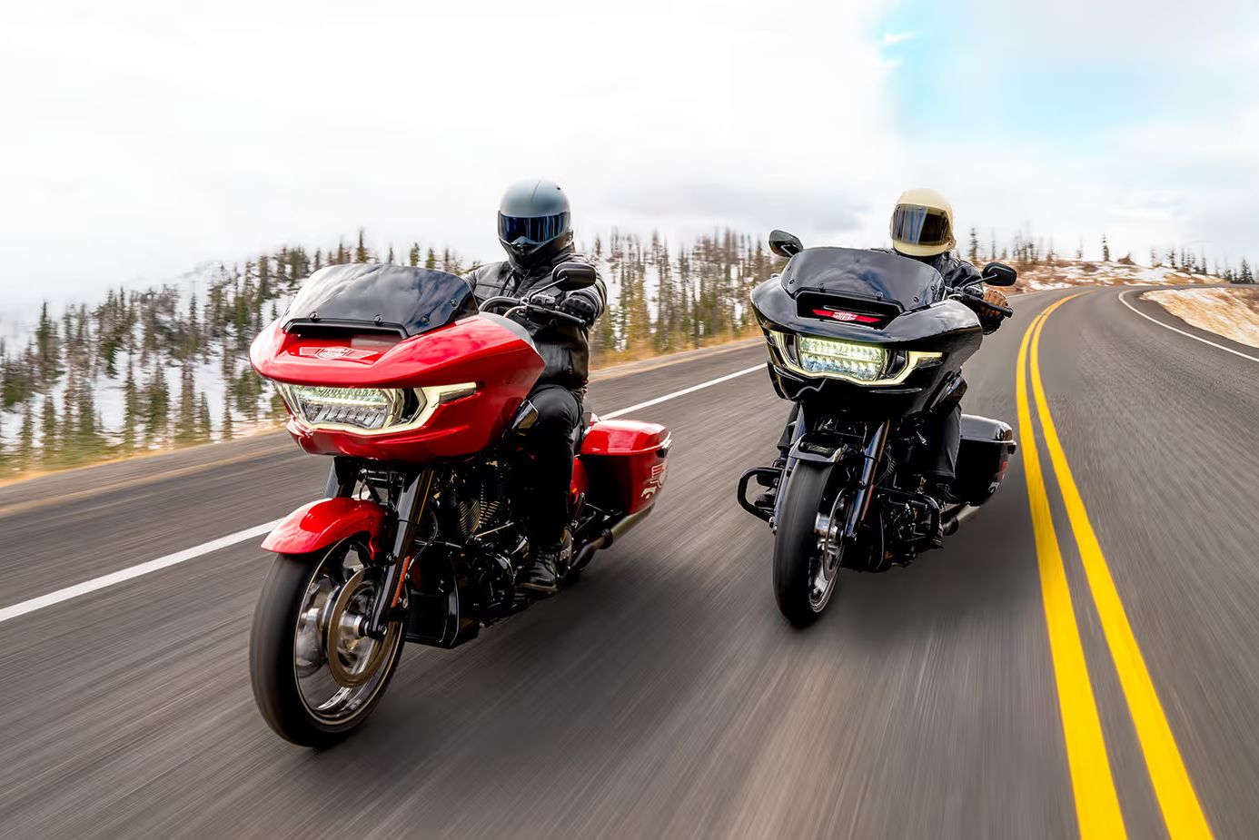Two 2025 Harley-Davidson Road Glide motorcycles ride side by side on a scenic highway, representing the Maverik Double Your Adventure Sweepstakes grand prize of two touring bikes, a custom trailer, cash, and free Coca-Cola for a year. The image shows sleek touring motorcycles in motion, highlighting the dual Harley-Davidson prize package featured in this Maverik sweepstakes giveaway.