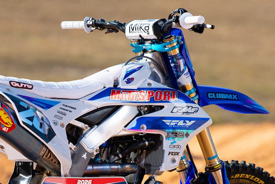 A blue and white 2026 Yamaha YZ250F motocross racebike displayed outdoors with MotoSport and ClubMX branding, showcasing the grand prize of the MotoSport ClubMX Ultimate Racebike Sweepstakes. This image highlights the Yamaha YZ250F dirt bike prize, premium motocross build, and professional racing setup featured in the MotoSport sweepstakes giveaway.