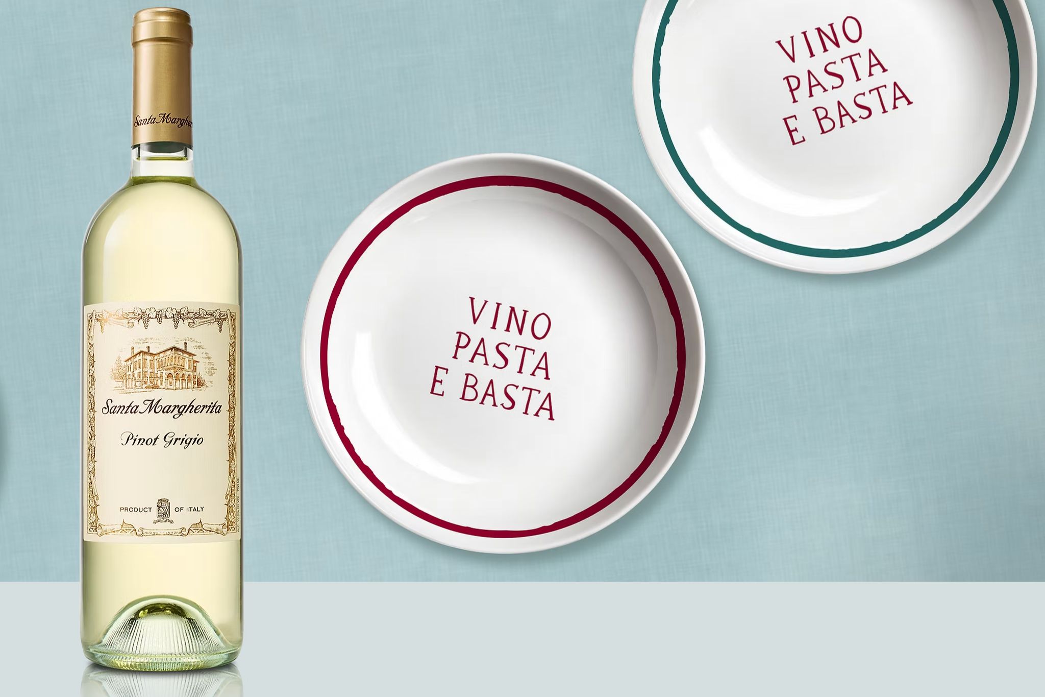 Santa Margherita Pinot Grigio bottle beside white plates that read Vino Pasta E Basta, a Santa Margherita Italian giveaway image suggesting a handmade Italian bowl set prize, kitchenware sweepstakes, and wine brand contest theme.