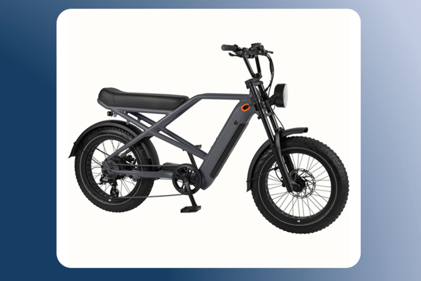 Matte gray electric bike with thick black tires, front suspension fork, and integrated battery mounted in the frame, shown in profile against a neutral background. This modern e-bike features wide all-terrain tires, a sturdy frame design, and a built-in battery system for powered riding. A sleek electric bicycle with a long padded seat, disc brakes, and pedal-assist capability designed for smooth, comfortable commuting or recreational rides.
