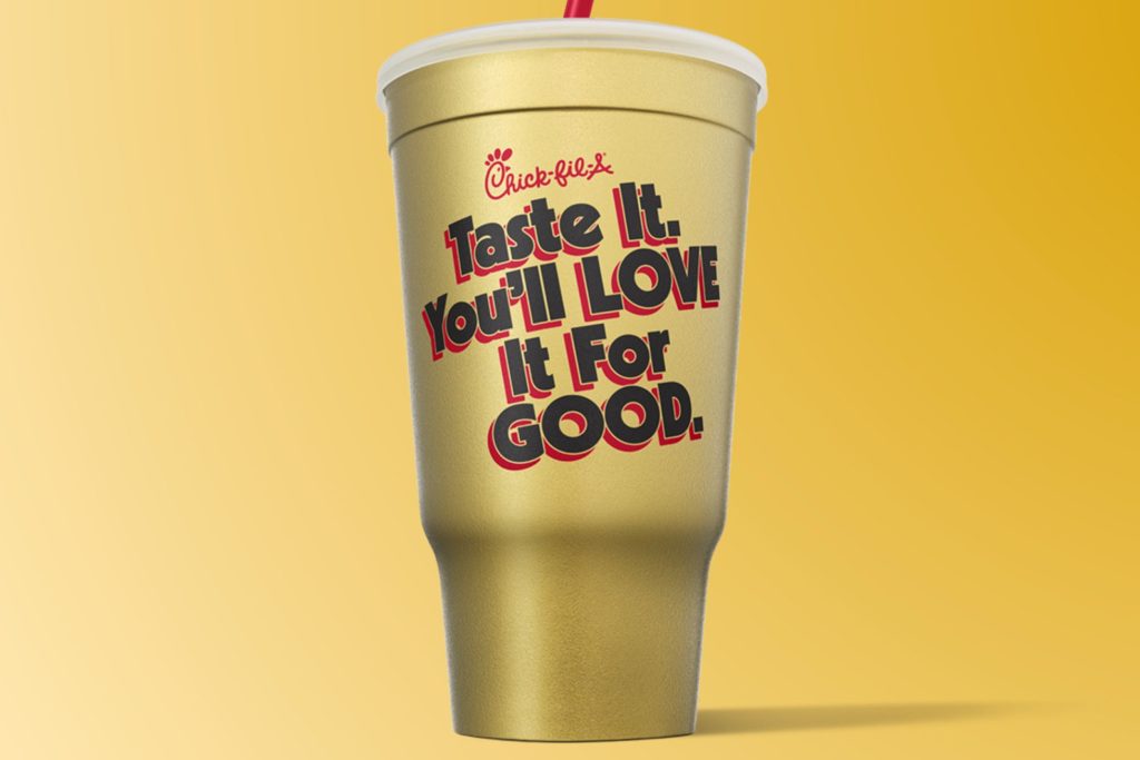 Gold Chick-fil-A collectible cup featuring the phrase “Taste It. You’ll Love It For Good.” representing the Golden Fan Cup Sweepstakes grand prize of Chick-fil-A for a year, awarded as 52 entrées loaded into a Chick-fil-A One account.