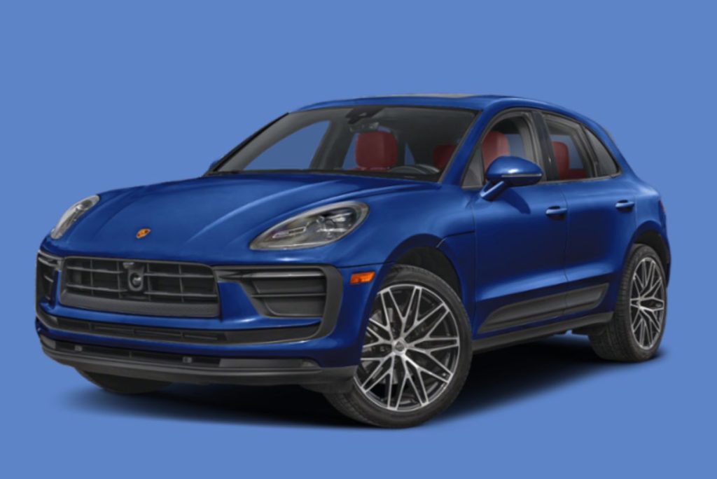 A blue Porsche Macan SUV shown at a three-quarter angle on a solid blue background, highlighting the sleek front grille and sporty wheels; a clean studio-style image of a Porsche Macan giveaway prize car; blue Porsche Macan sweepstakes prize vehicle photo for the 2026 Porsche Macan Giveaway.