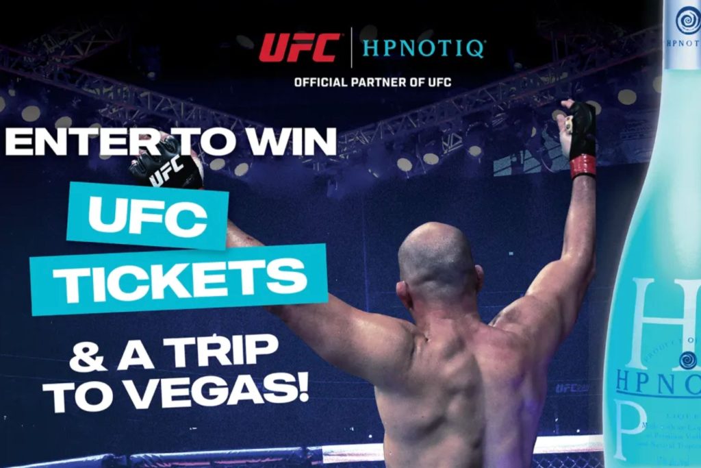 Promotional image showing a UFC fighter celebrating in the octagon with arms raised while advertising the Hpnotiq Hits Vegas with UFC Sweepstakes prize featuring UFC tickets and a Las Vegas trip. The graphic highlights the chance to win UFC fight tickets and travel to Vegas in the Hpnotiq UFC giveaway promotion. Marketing image promoting the Hpnotiq UFC sweepstakes with a Las Vegas trip prize, fight night tickets, and UFC merchandise.