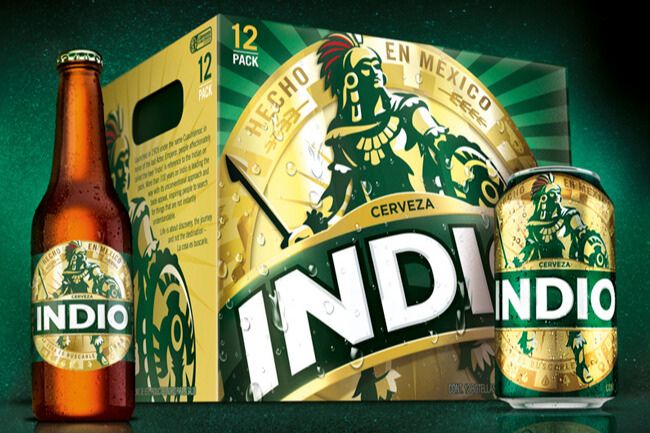 Indio Beer for a Year 2026 sweepstakes image showing an Indio cerveza bottle, an Indio can, and a 12-pack case on a dark green background with the bold INDIO logo. The photo highlights Indio beer packaging and branding used to promote the beer for a year giveaway. Product shot of Indio cerveza bottle and can next to a 12-pack, representing the Indio Beer for a Year sweepstakes prize theme.