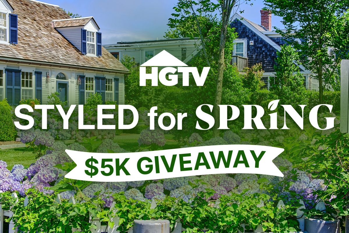 A charming residential scene featuring a well-maintained house surrounded by vibrant hydrangeas and lush greenery, creating a picturesque spring atmosphere, featured in the HGTV Styled for Spring Sweepstakes