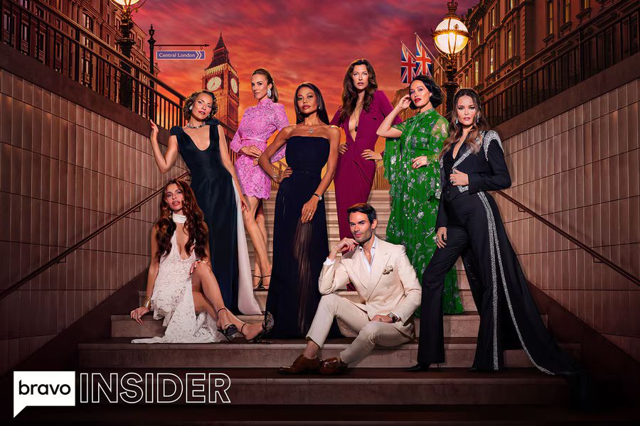 A diverse group of stylish individuals poses confidently on staircase steps against a vibrant sunset backdrop, showcasing elegant evening outfits and striking expressions, featured in the Bravo Ladies of London Trip Sweepstakes