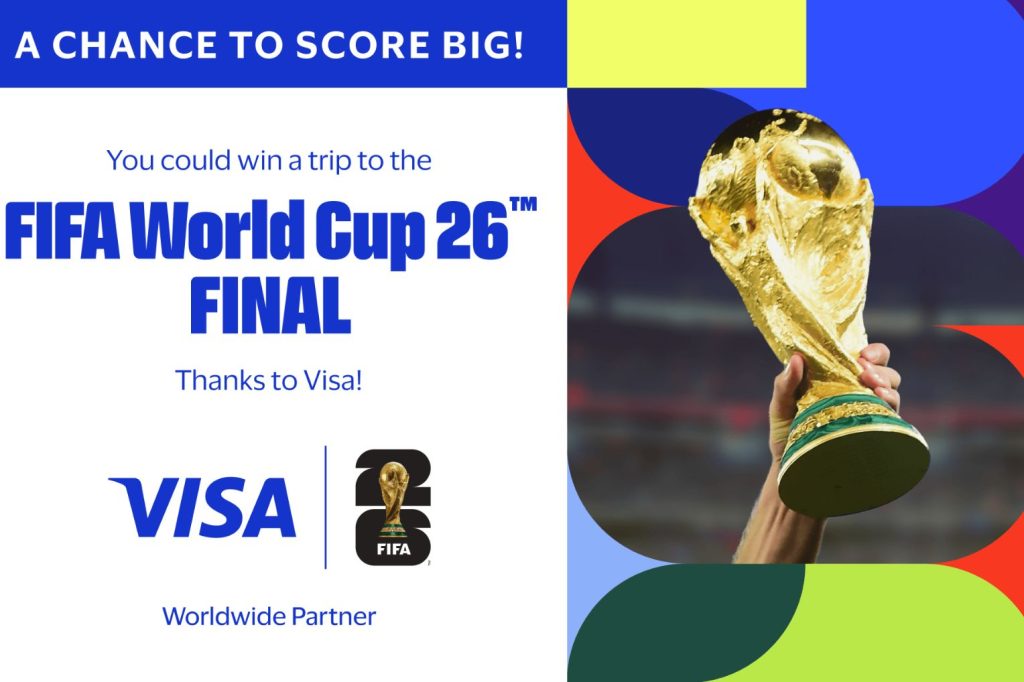 A golden trophy is held aloft, surrounded by colorful geometric shapes, promoting a chance to win a trip to the FIFA World Cup 26™ final. Excitement and anticipation shine through, featured in the Visa FIFA World Cup 2026 Sweepstakes