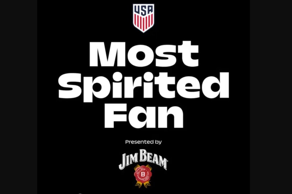 A bold, black background features large white text stating "Most Spirited Fan" with a small logo above and a brand name below, emphasizing the excitement of sporting events, featured in the US Soccer Match Tickets Sweepstakes