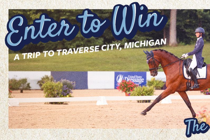 A rider in riding attire elegantly guides a horse through a dressage arena surrounded by lush greenery, showcasing their skills in a competitive setting, featured in the USEF 2026 Sweepstakes