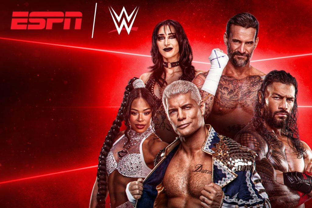 A group of four wrestling performers poses confidently against a vibrant red background, showcasing their unique styles and personalities, highlighting the excitement of professional wrestling, featured in the Disney+ WrestleMania 42 Sweepstakes
