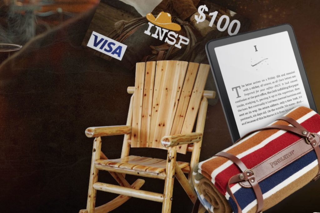 A wooden rocking chair is featured alongside a tablet displaying text and a rolled-up striped blanket with leather straps, set against a dark background, featured in the INSP Cowboy Comforts Sweepstakes