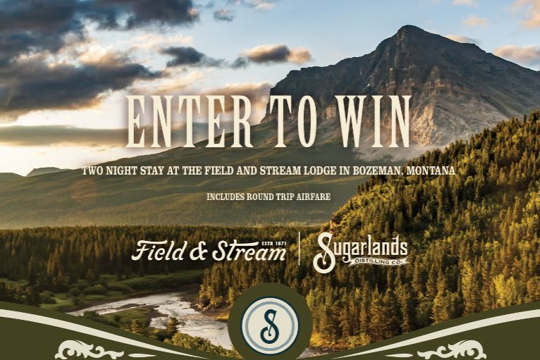 A scenic view of mountains, lush forests, and a river under a dramatic sky, inviting viewers to win a two-night stay at a lodge in Bozeman, Montana, featured in the Sugarlands Field and Stream Lodge Sweepstakes