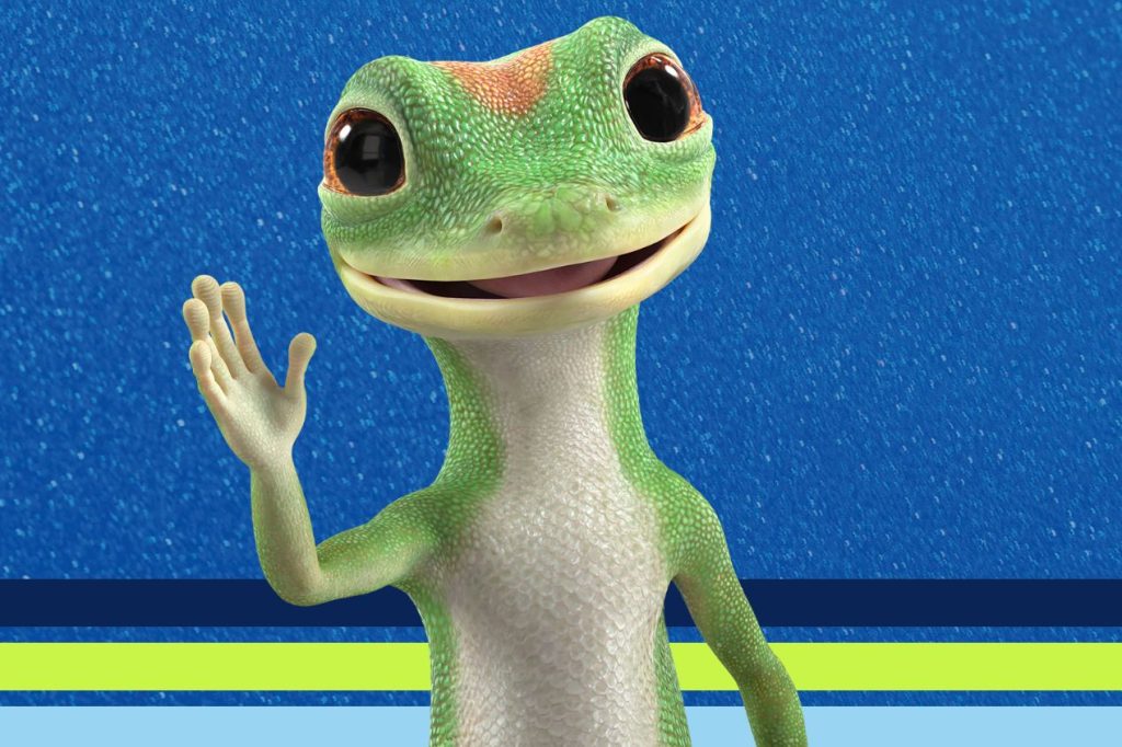 A friendly green gecko waves, smiling with large eyes against a blue background, showcasing a lively and engaging character, featured in the The Legendary Family Vacation Sweepstakes
