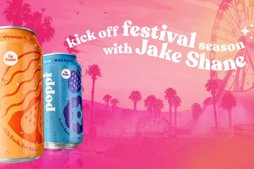 Two colorful beverage cans are prominently displayed against a vibrant pink festival backdrop with palm trees and a Ferris wheel, suggesting a lively atmosphere for summer festivities, featured in the Pepsi California Trip Sweepstakes