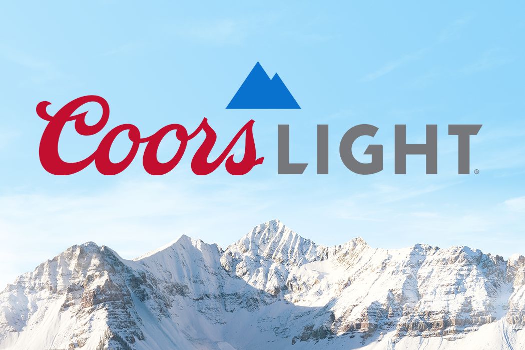 Snow-capped mountains under a clear blue sky create a picturesque backdrop, evoking a sense of adventure and the outdoors, featured in the Coors Light Tourney Time Sweepstakes
