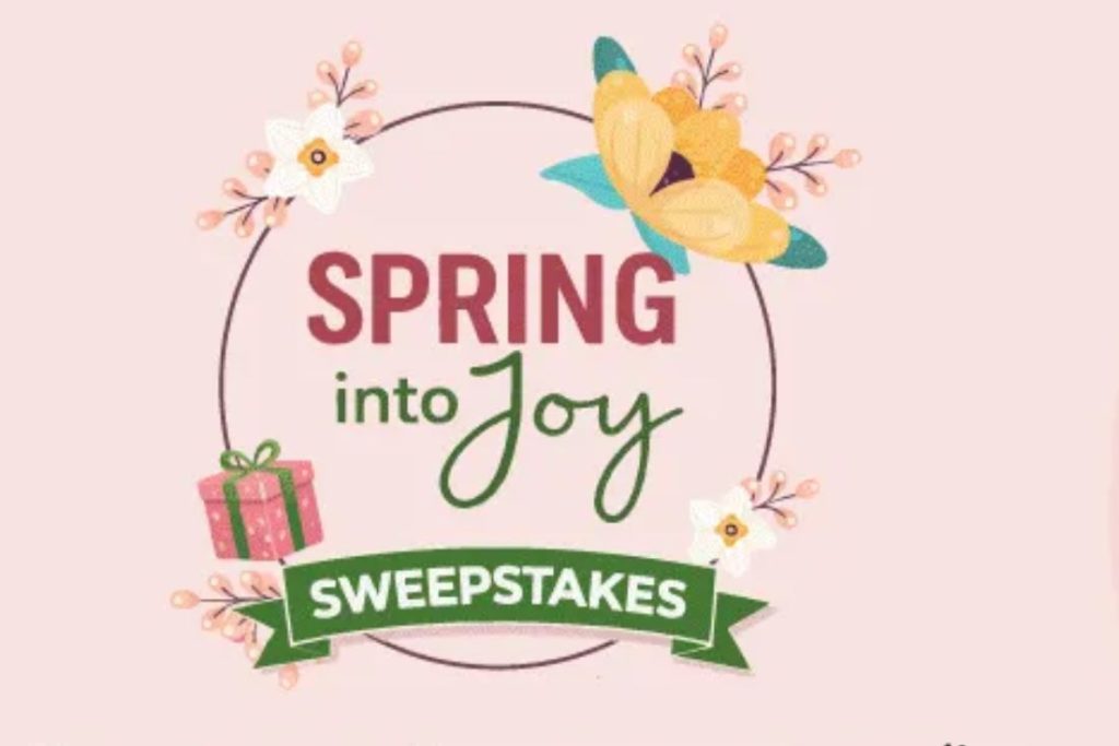 A colorful design featuring flowers, a gift box, and decorative elements highlights the phrase "Spring into Joy Sweepstakes" against a soft pink background, featured in the Shop LC Spring Into Joy Sweepstakes