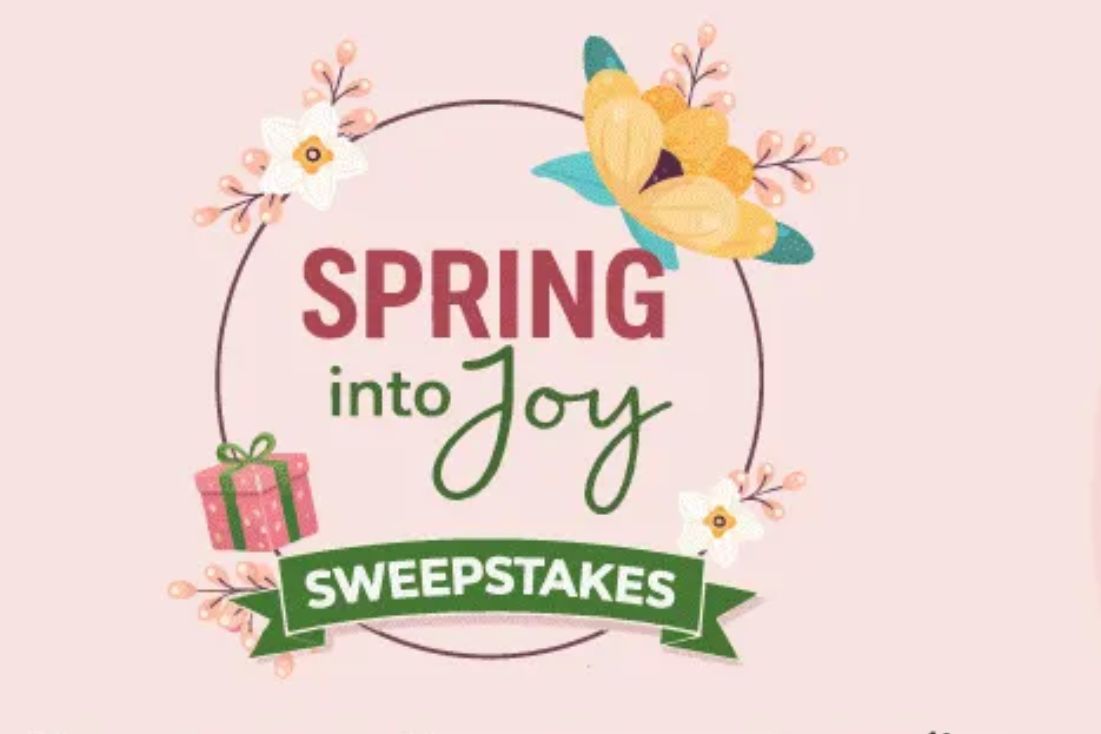 A colorful design featuring flowers, a gift box, and decorative elements highlights the phrase "Spring into Joy Sweepstakes" against a soft pink background, featured in the Shop LC Spring Into Joy Sweepstakes