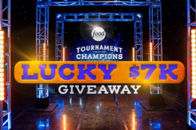 A vibrant stage setup features bright lights and a large banner promoting a "$7K Giveaway" for the Tournament of Champions, creating an exciting atmosphere, featured in the Food Network $7K Giveaway