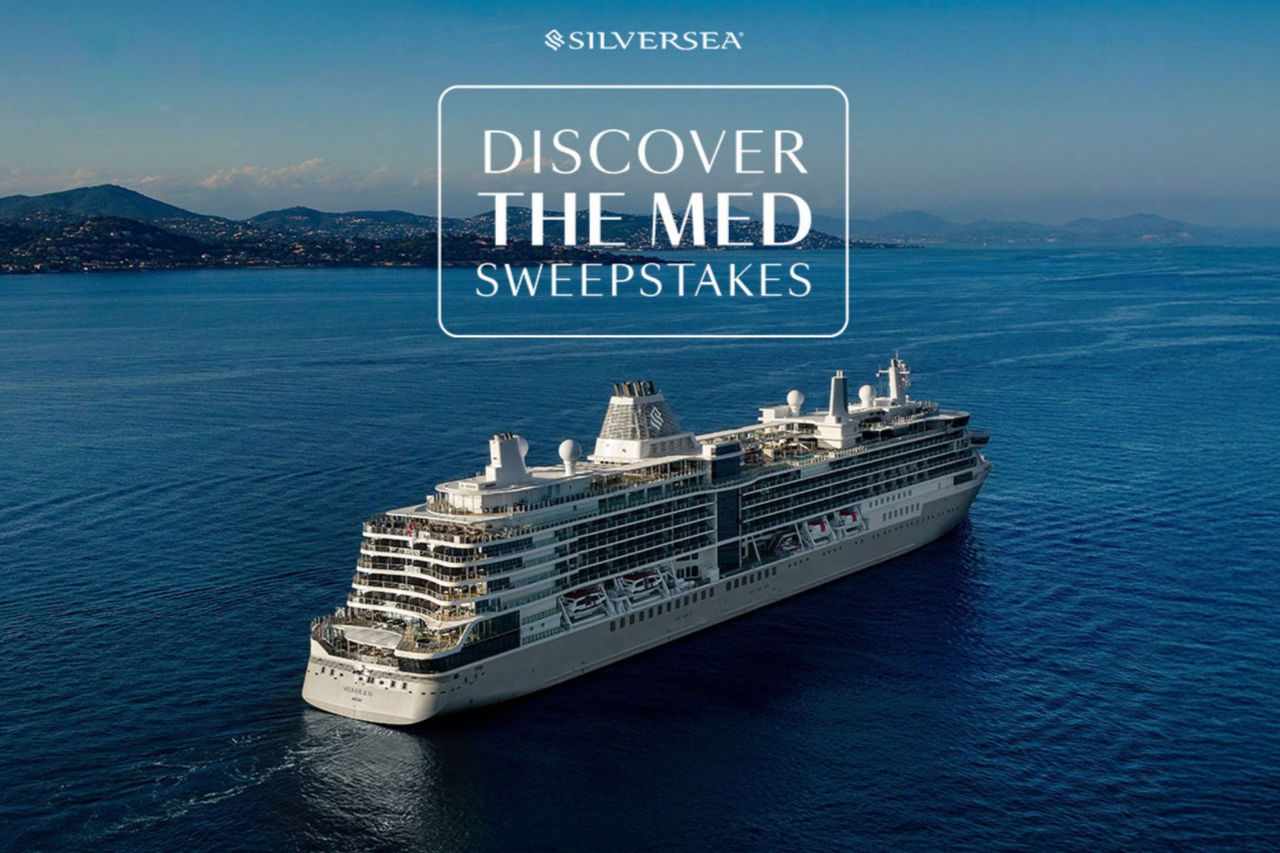 A luxury cruise ship sails through calm blue waters, surrounded by distant hills under a clear sky, showcasing an inviting getaway atmosphere, featured in the Discover the Med Sweepstakes