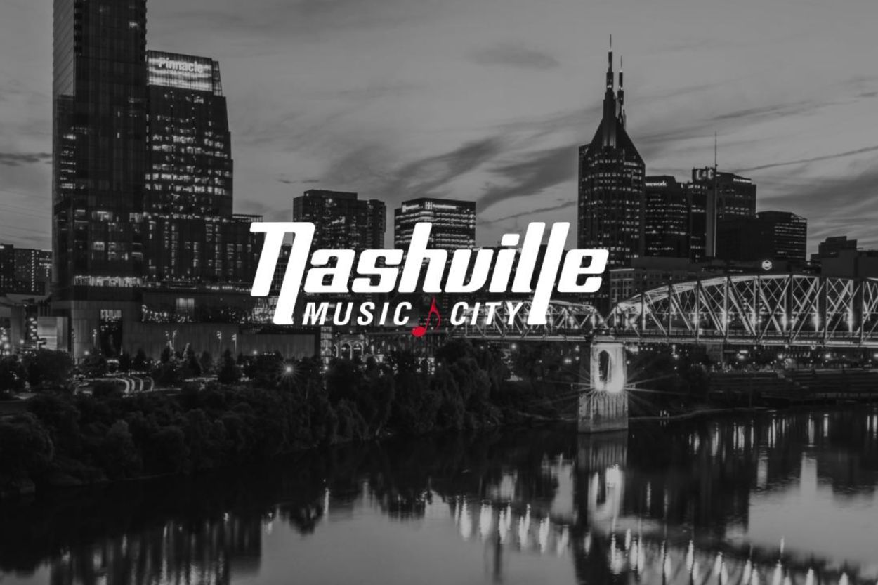 A panoramic view of Nashville's skyline at dusk, showcasing modern buildings and a bridge over a reflective river, with "Nashville Music City" prominently featured in the foreground, featured in the Flyaway to Music City Food & Wine Festival Giveaway