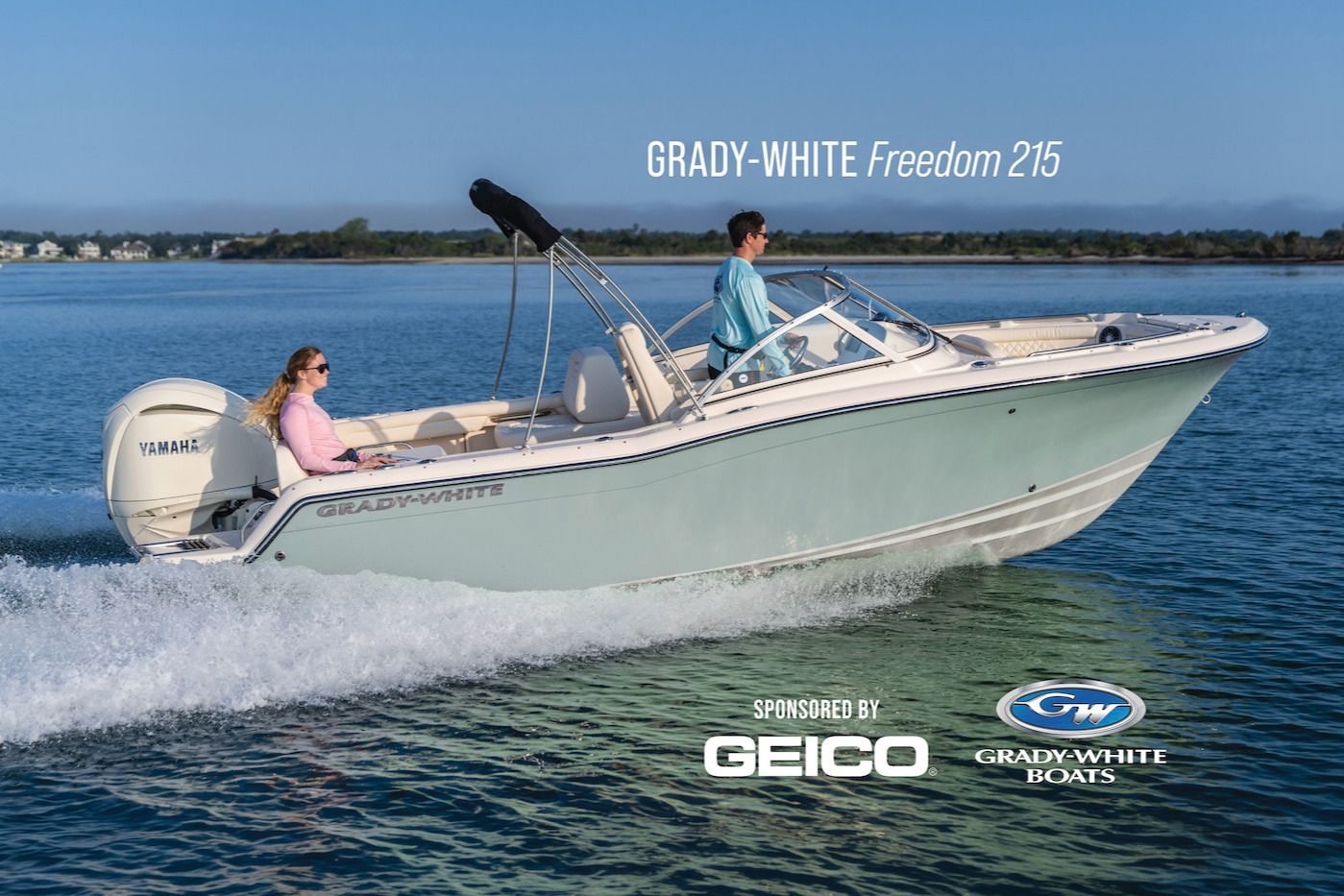 A light blue boat accelerates across calm water, with a young man steering and a woman sitting comfortably beside him, enjoying a sunny day on the water, featured in the BoatUS 60th Anniversary Sweepstakes