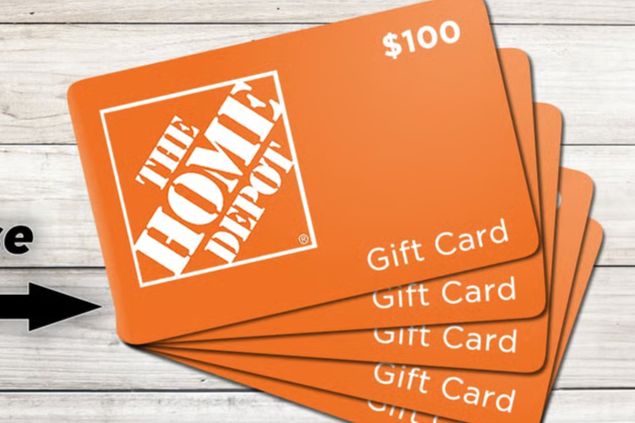 A stack of orange gift cards displaying a $100 value, arranged on a wooden surface, suggesting options for home improvement and DIY projects, featured in the Georgia 811 April 2026 Safe Digging Month Giveaway