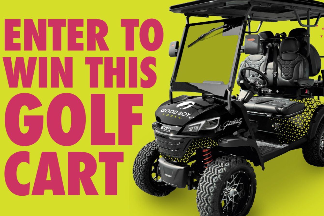 A stylish black golf cart with high-end seating is showcased against a bright yellow background, promoting a contest to win the vehicle, featured in the Good Boy Vodka Golf Cart Sweepstakes