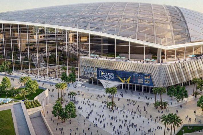 A bustling crowd gathers outside a large, modern stadium featuring a sleek design and a glass facade, surrounded by palm trees and green spaces, featured in the Webull Double Steal Sweepstakes