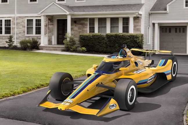 A vibrant yellow race car is parked in the driveway of a suburban home, contrasting with the neatly landscaped lawn and modern architectural features of the house, featured in the Penske Indy 500 VIP Sweepstakes
