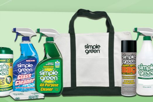 A set of cleaning products including glass cleaner, all-purpose cleaner, and heavy-duty BBQ cleaner, alongside a reusable tote bag, all arranged against a light green background, featured in the Spring Into Clean Sweepstakes