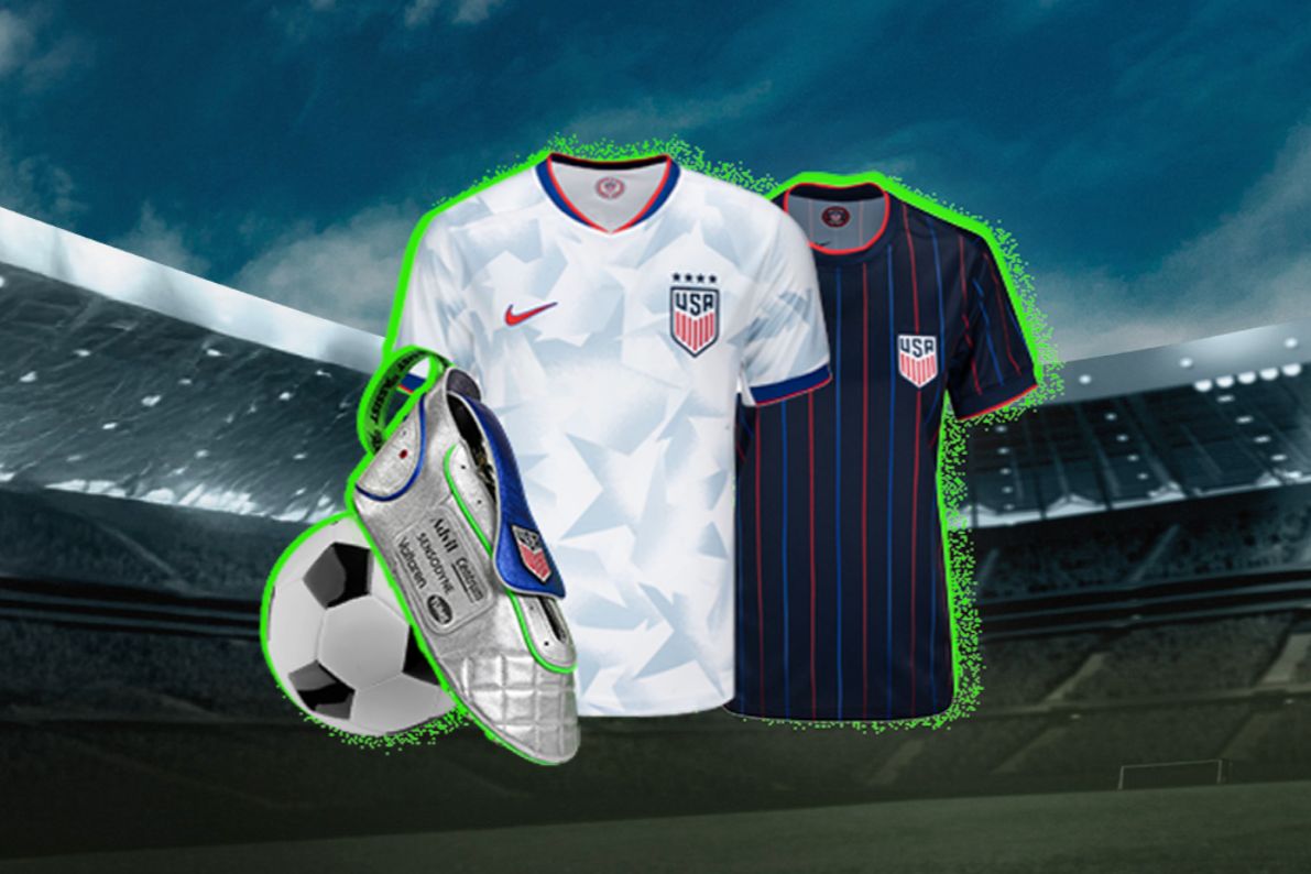 A soccer ball, two jerseys in white and navy, and silver cleats are displayed against a stadium backdrop, showcasing sports gear ideal for soccer enthusiasts, featured in the Haleon Summer Soccer Sweepstakes