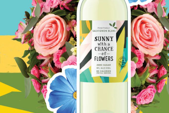 A bottle of Sauvignon Blanc, surrounded by vibrant flowers, features a colorful label reading "Sunny with a Chance of Flowers." The background is bright and cheerful, evoking a sunny atmosphere, featured in the Sunny with a Chance of Flowers Flower Subscription Sweepstakes