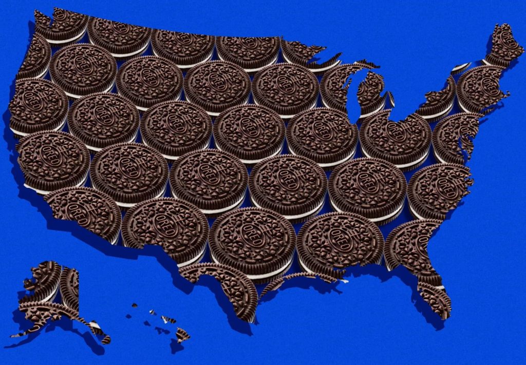 A map of the United States is creatively filled with rows of chocolate cookies, resembling Oreo cookies, over a bright blue background, featured in the Oreo $1,000 Sweepstakes