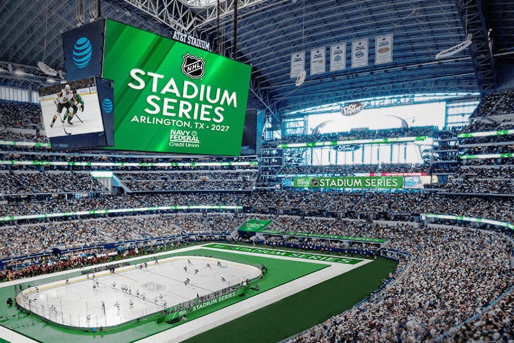 A vibrant hockey game is underway in a packed stadium, with players on the ice and enthusiastic fans watching from the stands. Large screens display event details above the action, featured in the NHL Stadium Series Sweepstakes