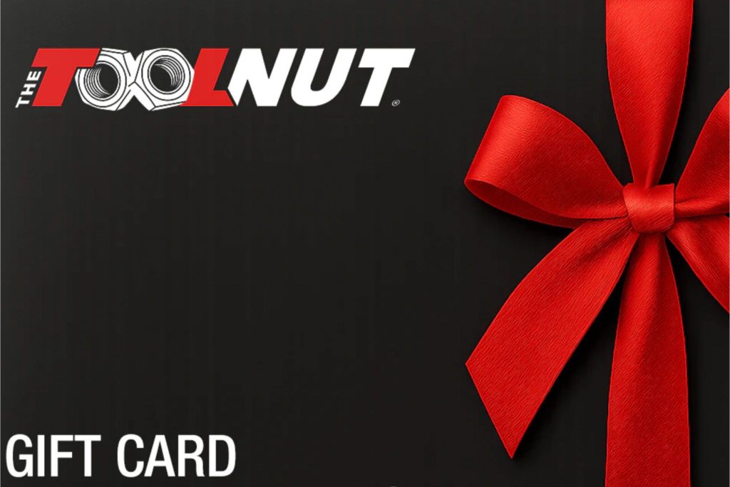 A festive black gift card features a large red ribbon bow, creating an elegant presentation perfect for giving or receiving as a present, featured in the Tool Nut $500 Sweepstakes