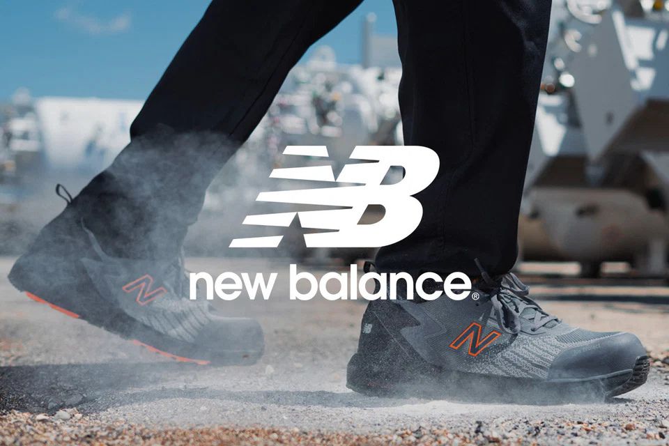 A person walks through a dusty area, showcasing a close-up of their athletic shoes, kicking up clouds of dust as they step, featured in the Lehigh Outfitters New Balance Gift Card Sweepstakes