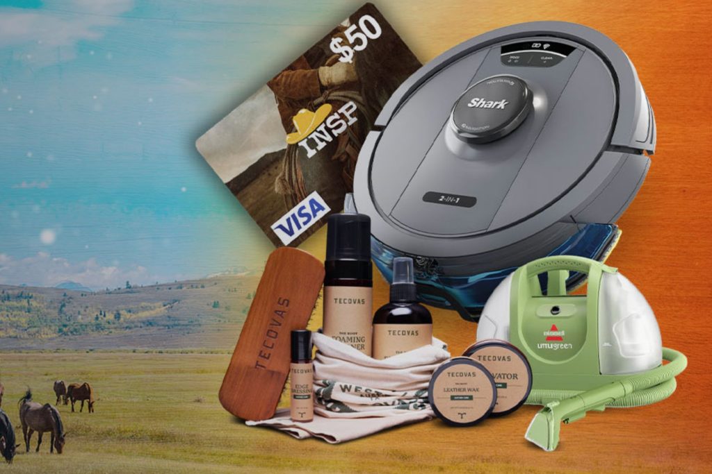 A robotic vacuum cleaner sits alongside a green steam cleaner and various grooming products, all displayed on a vibrant landscape background featuring horses, featured in the INSP Ranch Refresh Sweepstakes
