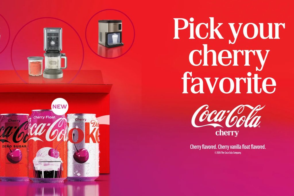 A vibrant red background features several cans of cherry-flavored Coca-Cola, alongside kitchen appliances for preparing drinks. The focus encourages viewers to choose their cherry favorite, featured in the Coca-Cola Year of Cherry Sweepstakes
