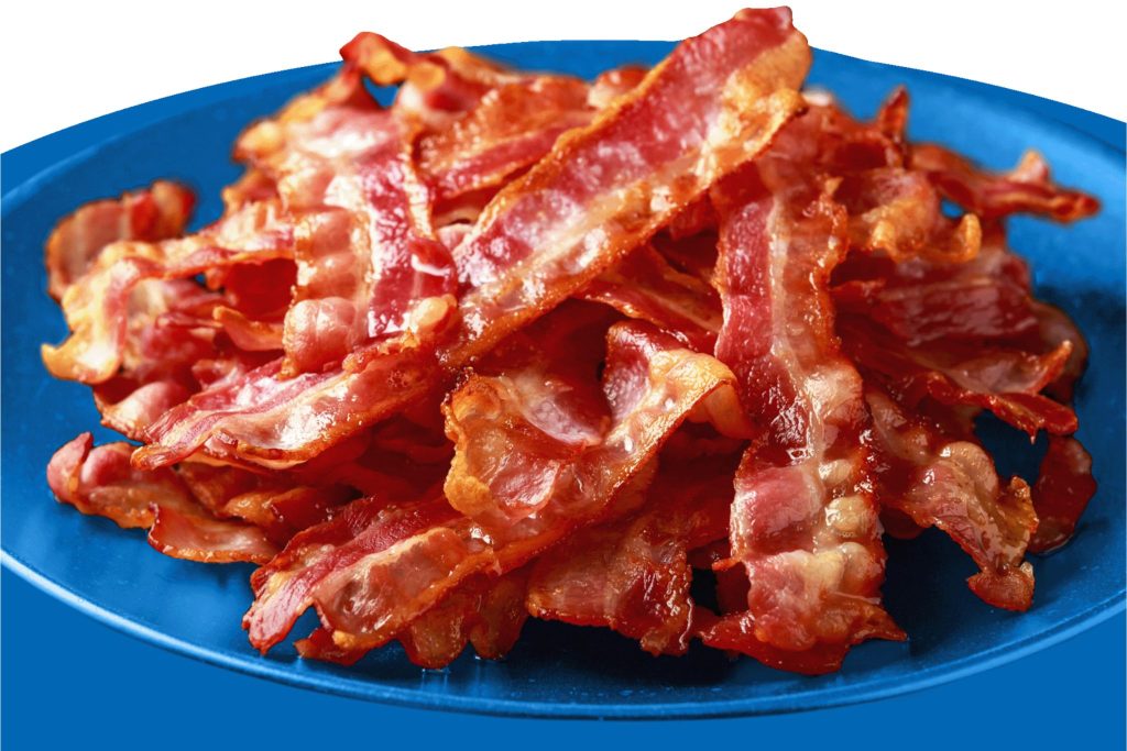 A close-up view of crispy, golden-brown bacon strips piled high on a vibrant blue plate, showcasing the delicious texture and color of the cooked meat, featured in the Farmland Big Book of Bacon Sweepstakes