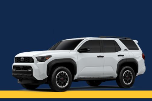 A sleek white SUV stands against a dark blue backdrop, showcasing its bold design and sturdy build, ready for adventure, featured in the Toyota 4Runner Home Run Sweepstakes