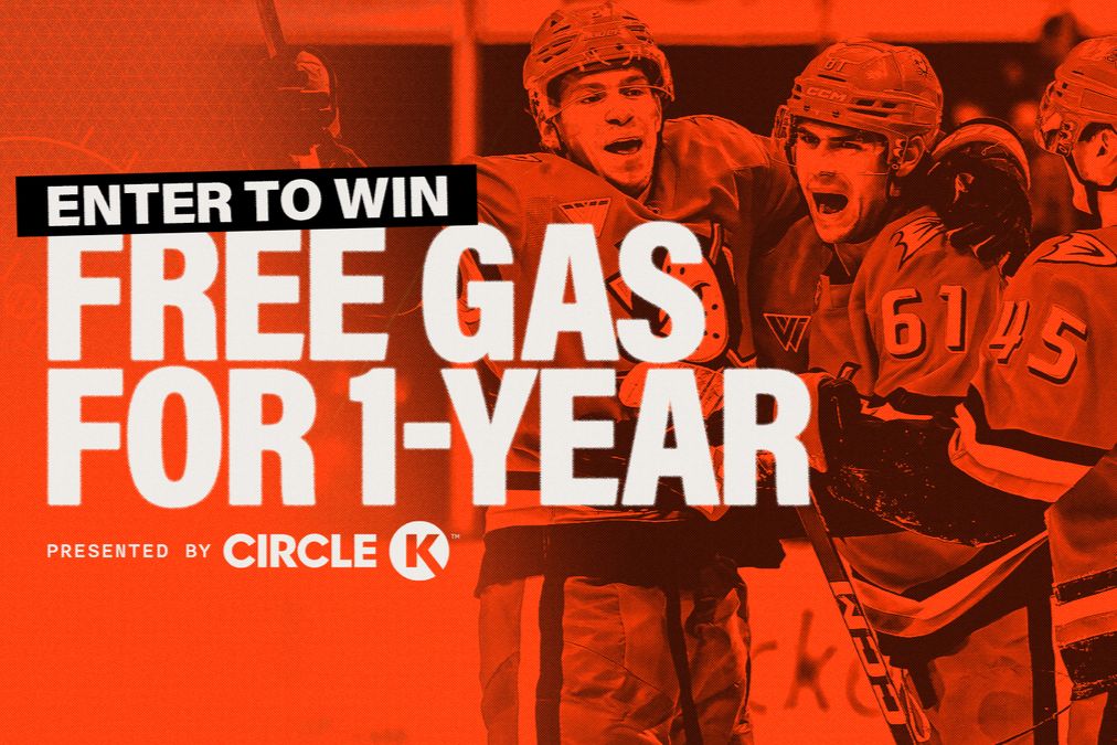 Three excited hockey players celebrate a goal, embracing each other in a lively scene on the ice with an orange background highlighting a contest for free gas for a year, featured in the Circle K $2,300 Gift Card Sweepstakes