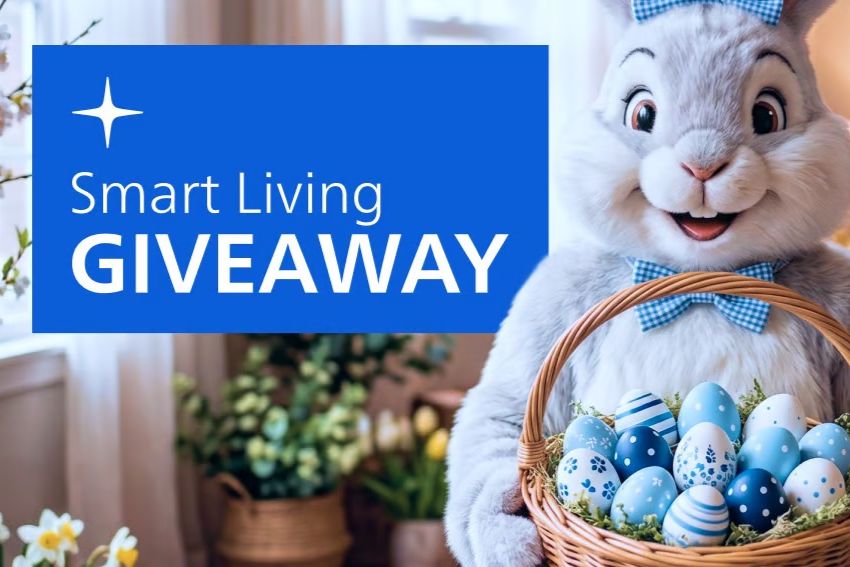 A cheerful bunny holds a woven basket filled with decorative blue and white Easter eggs, surrounded by bright flowers in a cozy, well-lit room, featured in the Philips Smart Living Giveaway