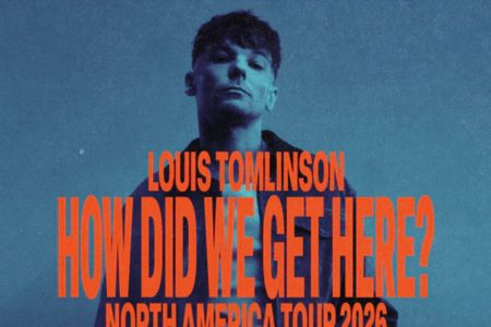 A man with tousled hair stands against a blue background, striking a pensive pose. The words "HOW DID WE GET HERE?" and "NORTH AMERICA TOUR 2026" are boldly displayed, featured in the How Did iHeart Get Here? Sweepstakes