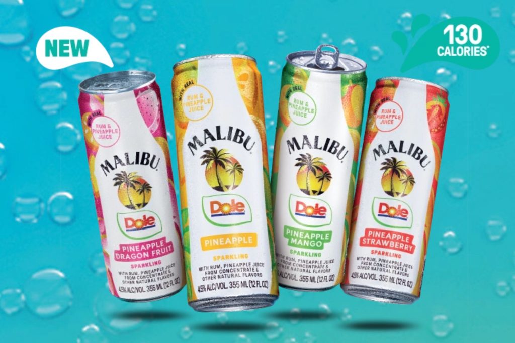 Four colorful cans of Malibu sparkling beverages are displayed against a bright blue background with water droplets. Flavors include Pineapple-Dragon Fruit, Pineapple, Pineapple Mango, and Pineapple Strawberry, featured in the Malibu Hawaii Trip Sweepstakes